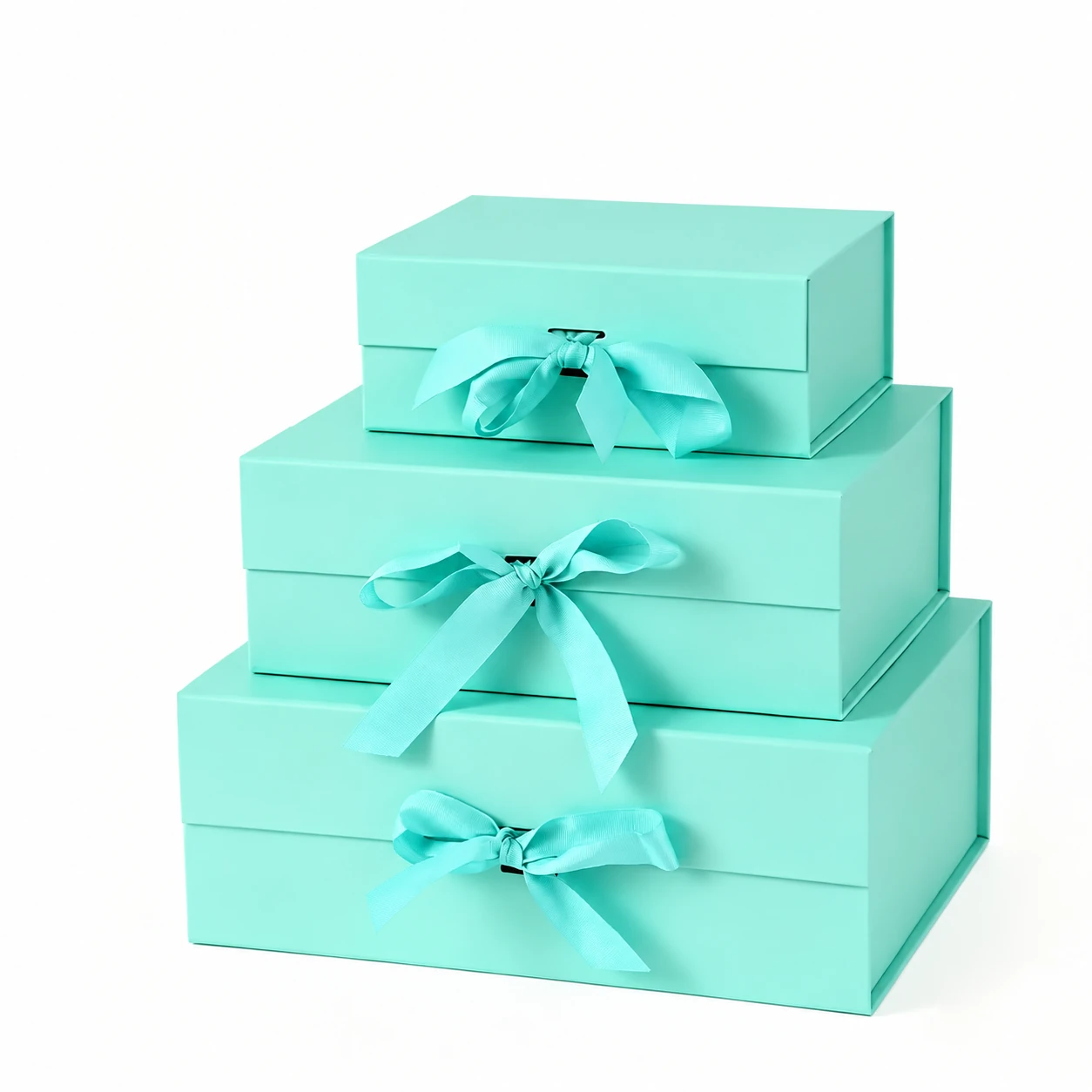 Three mint-green hinged gift boxes in different sizes with matching ribbon bows
